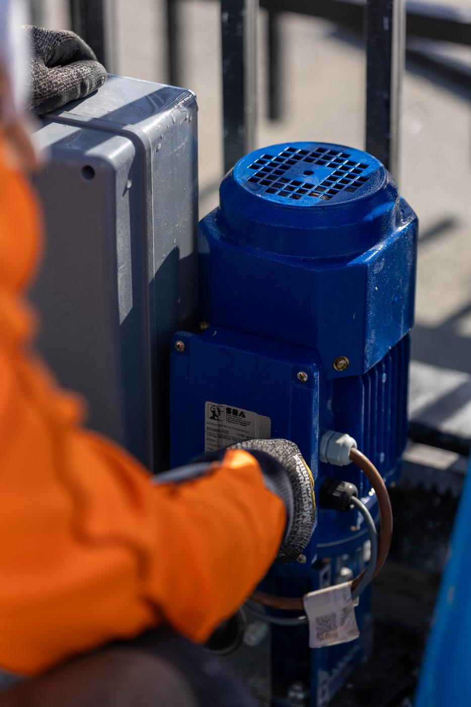 RMF technician working at a gate control box