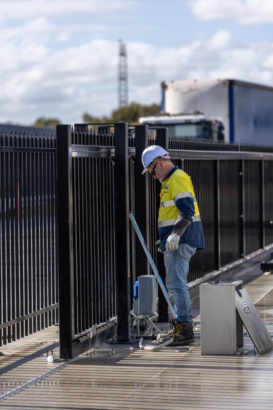 Two RMF technicians setting up a gate motor