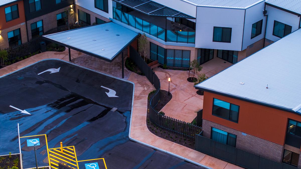 Aerial view of a completed development with perimeter fencing
