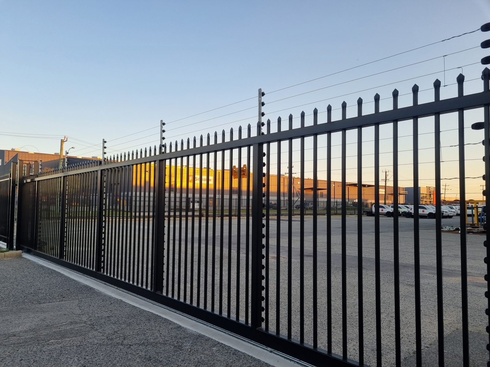 Palisade security fencing with an electric fence top at the PMG Welshpool site