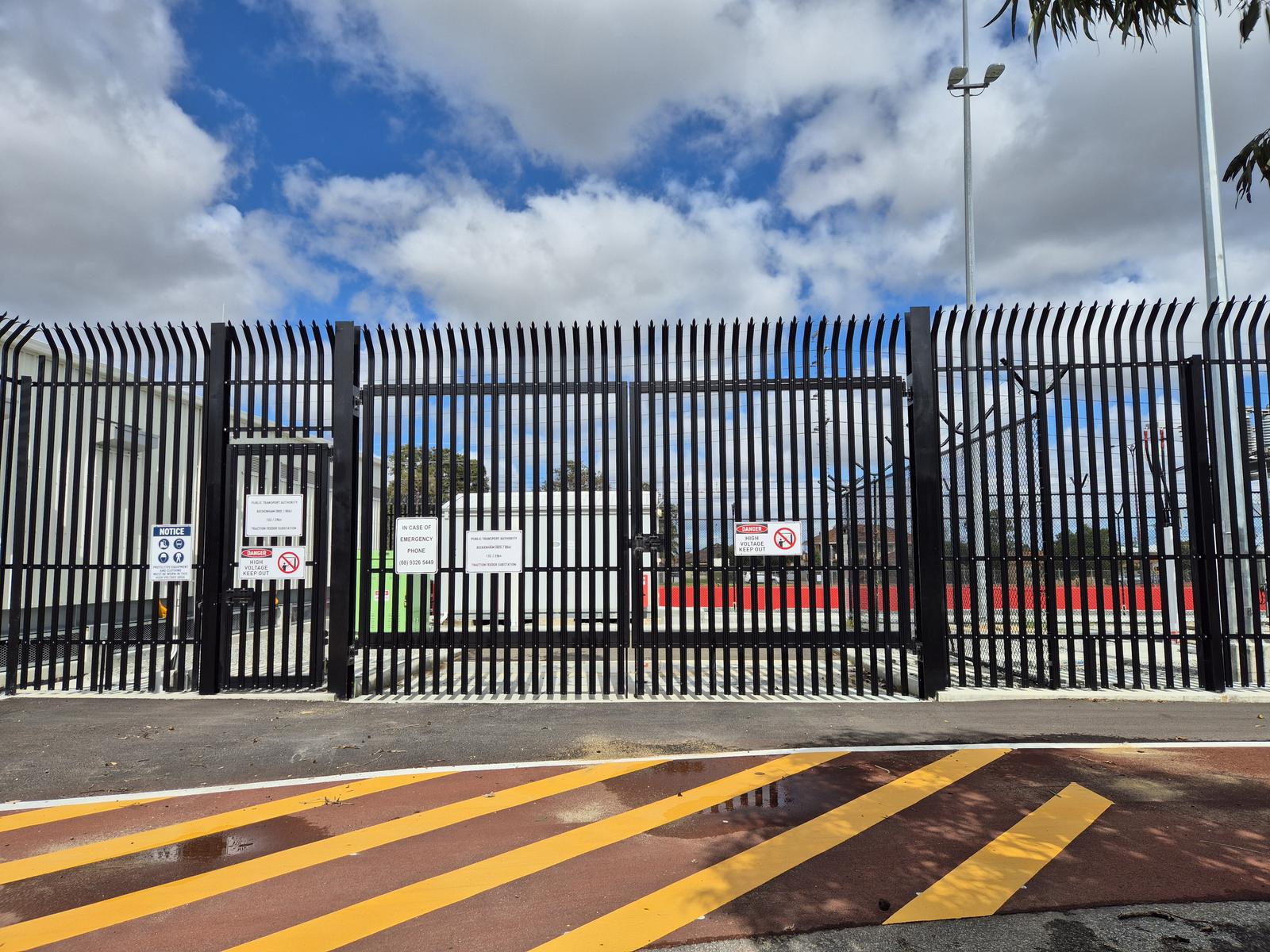 Palisade security fencing and gates around a secure compound