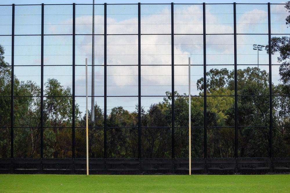 Tall black AFL back net behind the goals