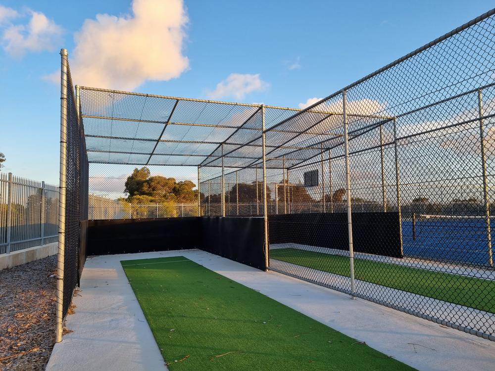 Chainmesh cricket practice nets with synthetic pitches