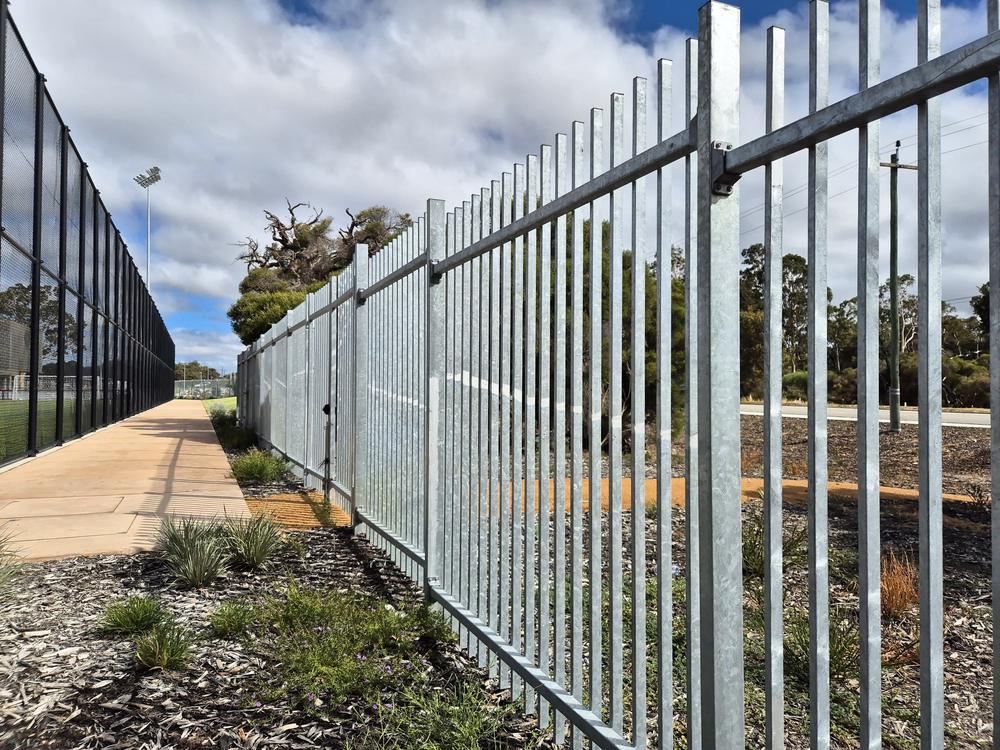 Galvanised Garrison fencing along a sports oval path